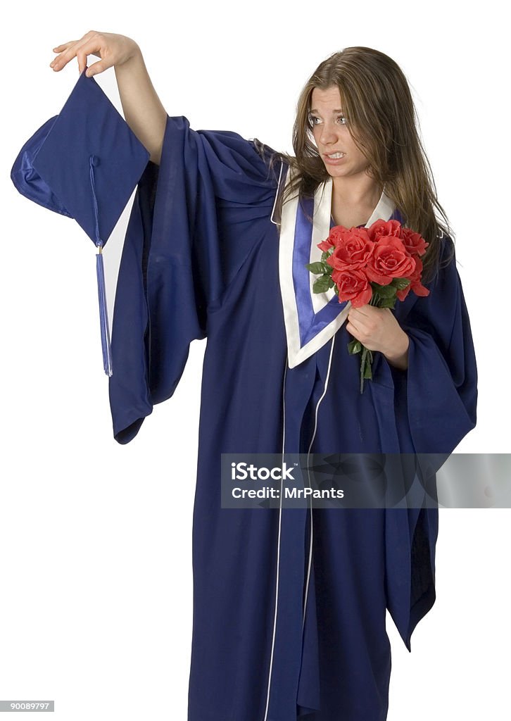 Grad Student Female student wearing grad gown with reluctant facial expression Graduation Stock Photo