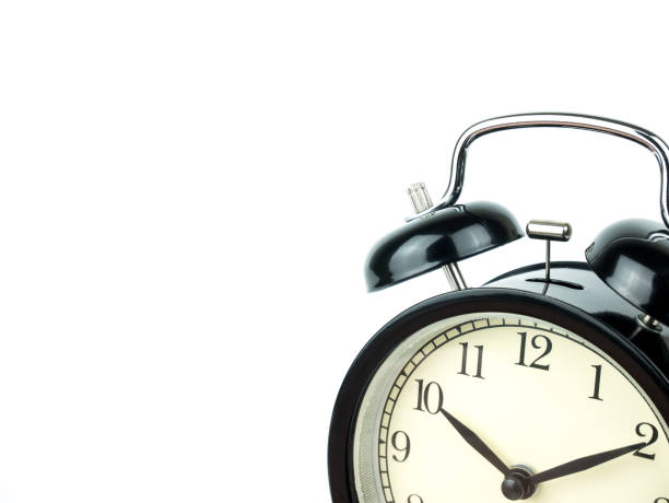 istock Alarm Clock on white, showing ten o'clock on white background 900898354