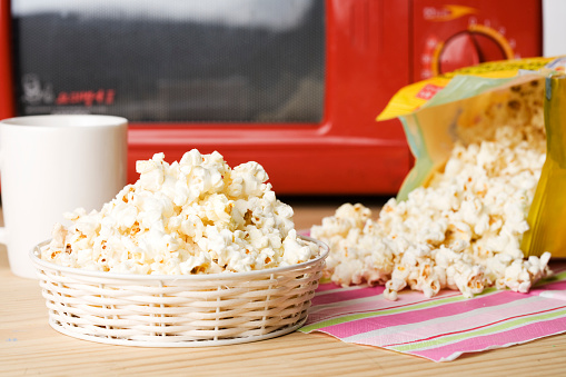 Soft butter popcorn after the cooking in the microwave oven