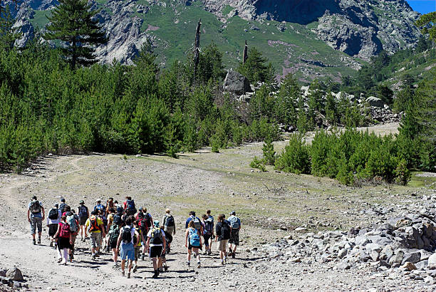 People Going Up the Mountain stock photo