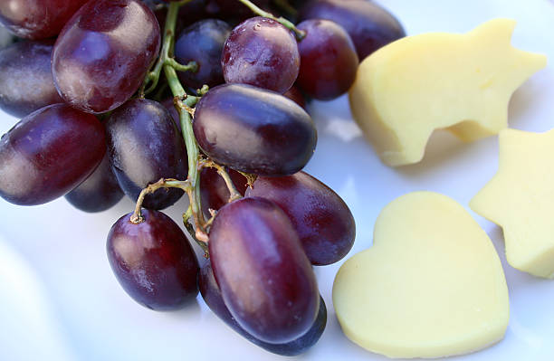 traube und käse - grape heart shape fruit bunch stock-fotos und bilder