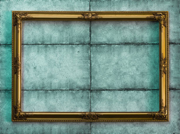 istock golden Victorian baroque frame on a green wall 900911902