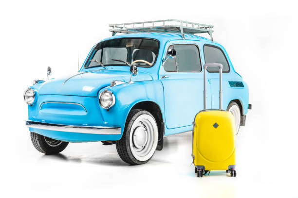 istock blue retro car with luggage 900912976