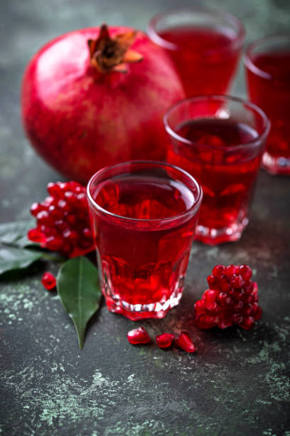 istock Glasses of fresh pomegranate juice. 900916722