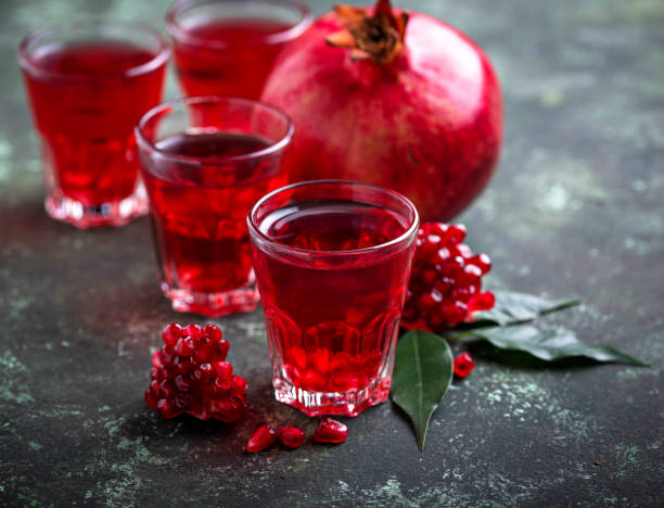 istock Glasses of fresh pomegranate juice. 900916804