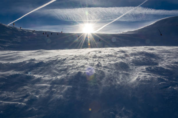istock Sun shining over a slope in the Autrian mountains 900921364