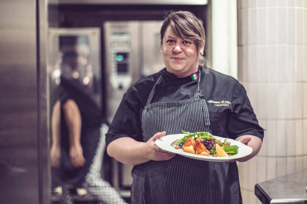 istock Chef is working in an italian restaurant 900925216