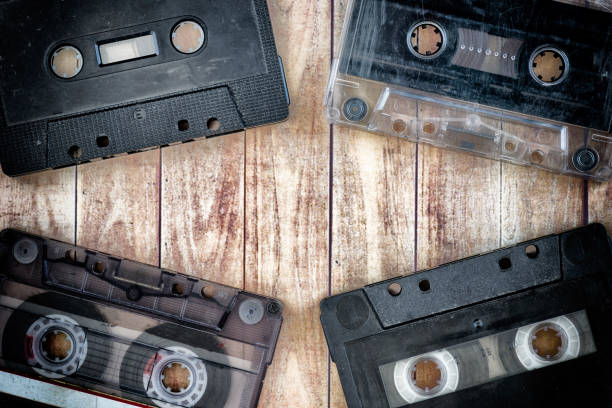 istock Old cassette tapes with a wooden background 900928696