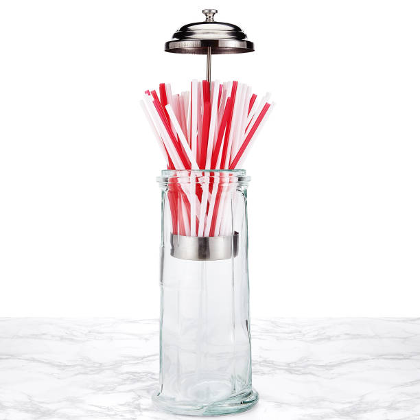 Glass and stainless steel straw holder stock photo