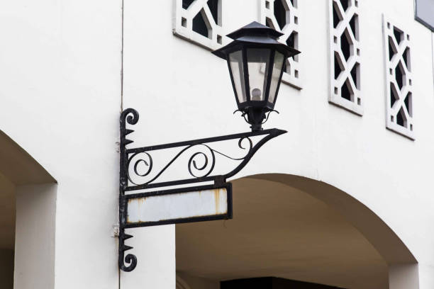 istock Old lamp and street sign 900929888
