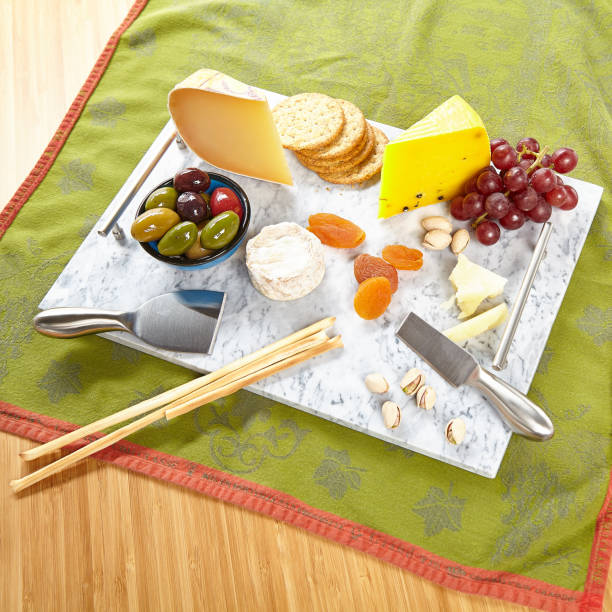 Cheese board with various appetizers stock photo