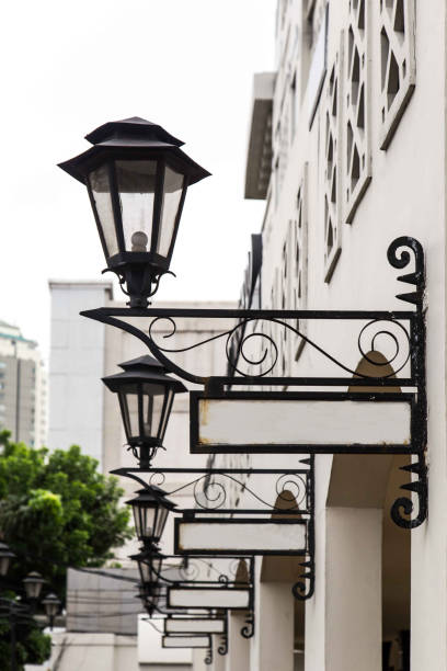 istock Old lamp and street sign 900929930