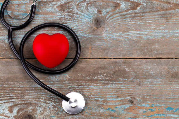 istock Stethoscope with red heart on a wood background,with copy space 900933076