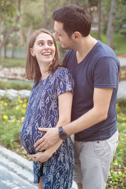 Great expectations Happy couple waiting for baby 8 months pregnant stock pictures, royalty-free photos & images