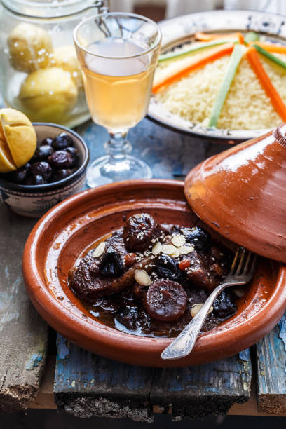 istock Slow cooked beef with prunes, figs, raisins and almonds - moroccan tajine. 900937502