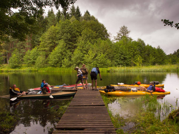 canoeing excursion River Wda: A break  at a  pier during  canoeing excursion cabot trail stock pictures, royalty-free photos & images