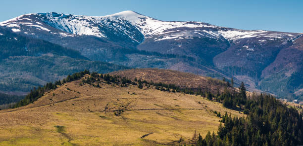 istock Borzhava mountain ridge with snowy tops 900937754