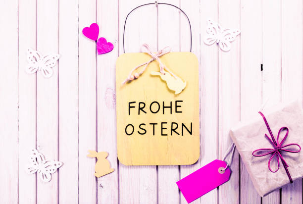istock Easter chalkboard decoration background with gift box and blank sale tag with copy space. happy easter in german language 900938076