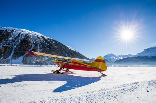 Skiplane parked on a snowy airfield
