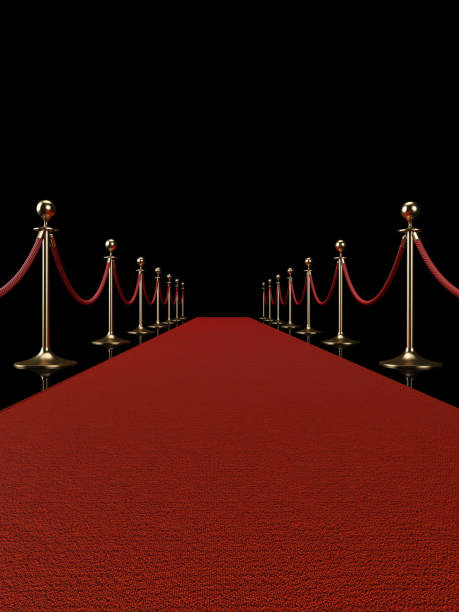 istock Red Carpet Concept - Red Carpet And Barrier Ropes On Black Background 900945274