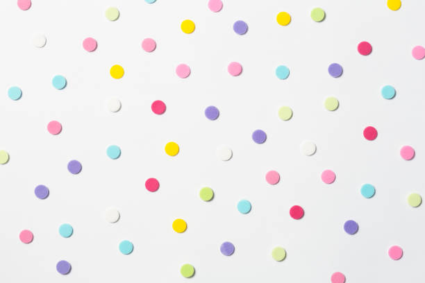 Confetti. Colorful dots view from above on a light background. Top view stock photo