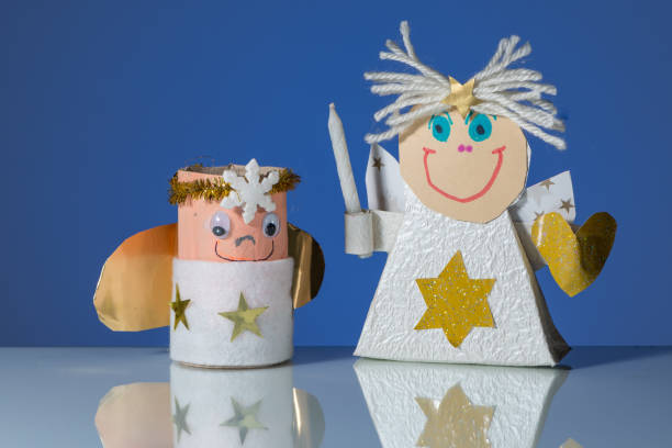 istock Two handicraft angels made by a child 900950102
