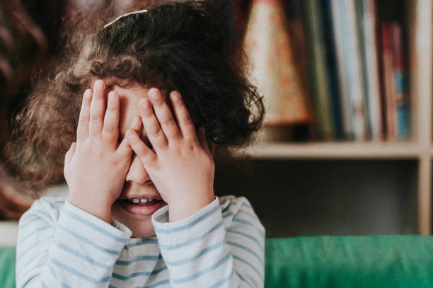 istock Child (4-5) Covering her Face 900951334