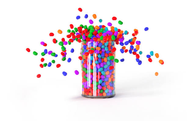 candies explode out of the jar. - candy coated imagens e fotografias de stock