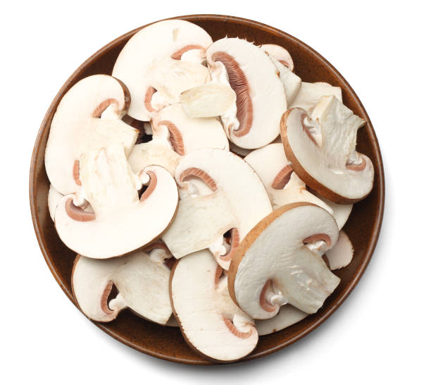 istock Fresh champignon mushrooms isolated on white background. top view 900955188