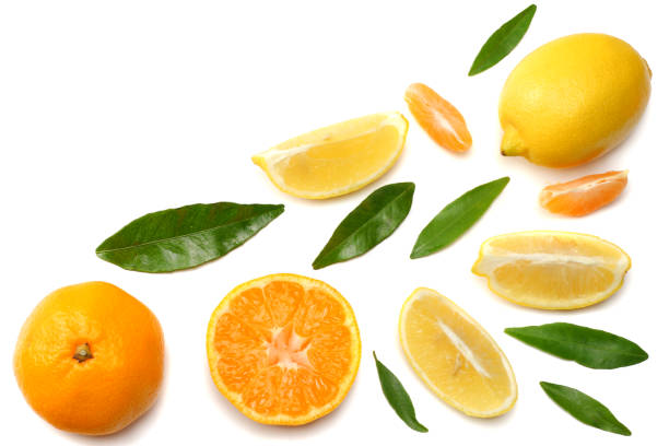 istock mandarin with slices, lemon and green leaf isolated on white background top view 900955216