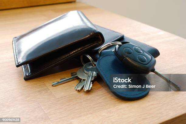 Wallet Car Key House Keys And Mobile Phone On A Table Stock Photo - Download Image Now