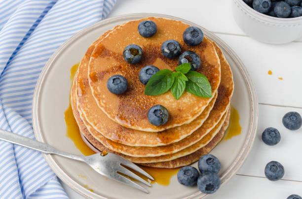 istock Stack of pancakes with fresh blueberry and caramel syrup 900962056