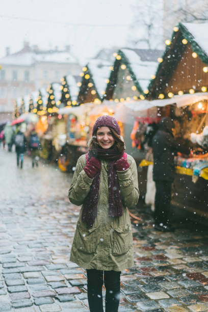 istock Woman walking on Christmas market 900962120