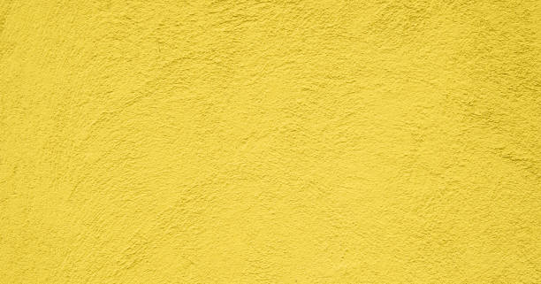 istock Grunge Decorative Yellow Stucco Wall Texture 900964858