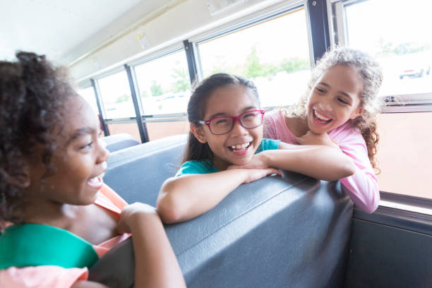 istock School girls laugh on their way to school 900966080