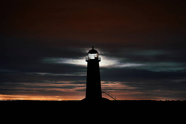 Supermoon full moon Backlights a Lighthouse stock photo