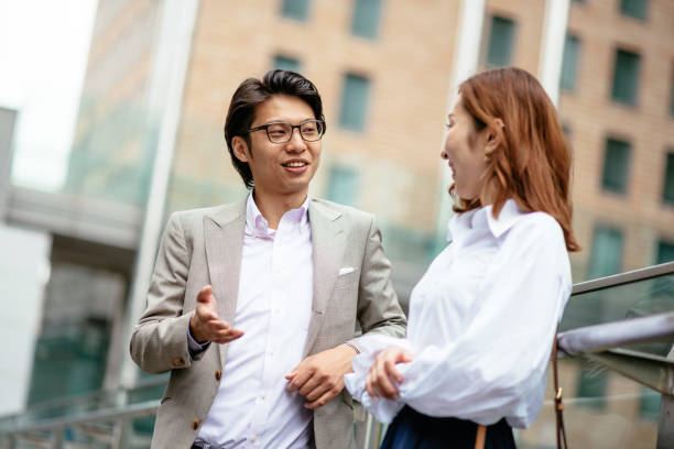 istock Japanese young man meeting his spouse after work 900971920