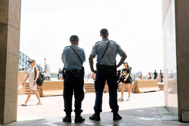 police officers patrol the street in sydney, copy space - circular quay fotos imagens e fotografias de stock