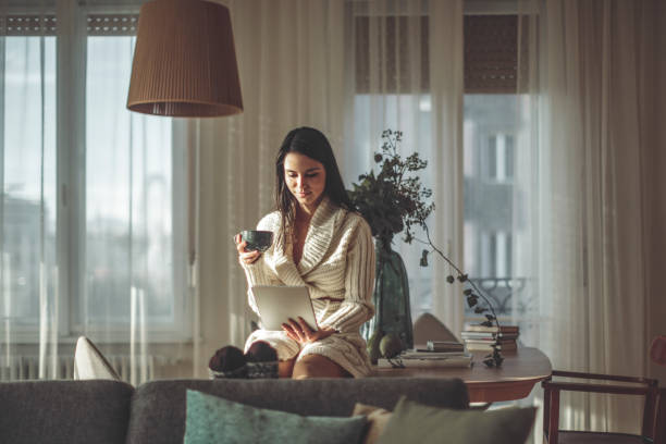 istock Young woman at home 900979304