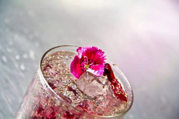 Gin with lemon slice and ice in wine glass. Selective focus.