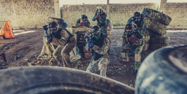 istock Players with paintball guns 900991148