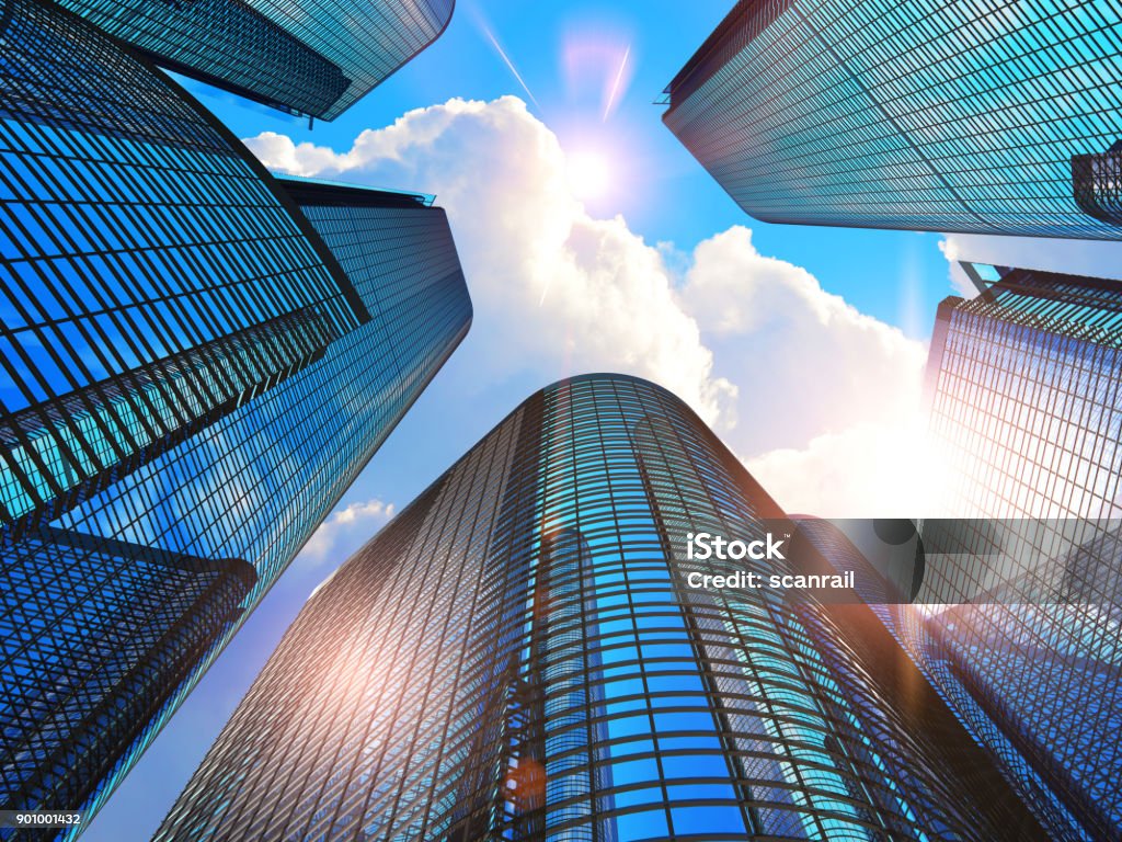 Modern business buildings Downtown corporate business district architecture concept: 3D render illustration of the glass reflective office buildings skyscrapers against blue sky with clouds and sun light Building Exterior Stock Photo