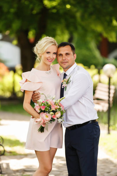 istock Happy couple in love smiling and looking to camera 901002280