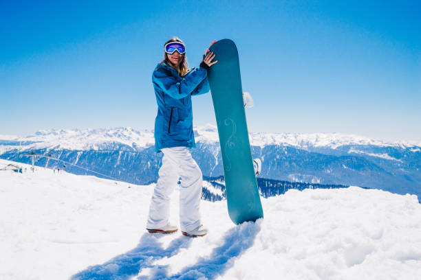istock young  snowboarder woman 901011026