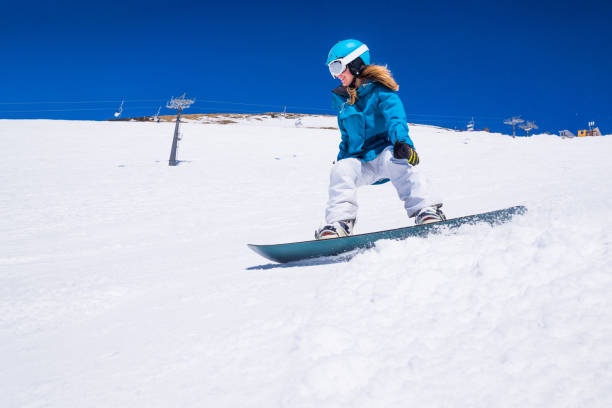 istock young  snowboarder woman 901011062