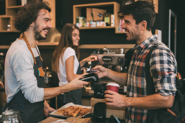 istock Customer paying with a credit card at a coffee shop 901032006