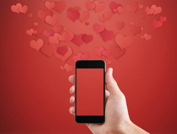 istock Mobile smart phone, on red background with floating hearts. Valentines, love message and texting concept 901034348