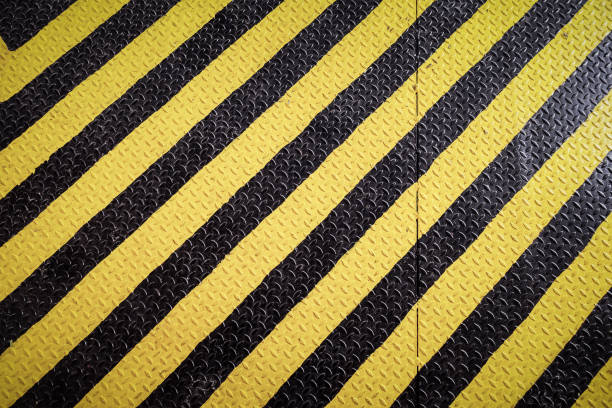 istock yellow and black marking warning sign, grunge background 901042934