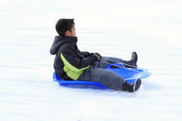 istock Japanese boy on the sled (second grade at elementary school) 901046002