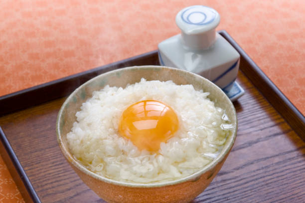 istock Raw egg on the rice with soy sauce 901049296